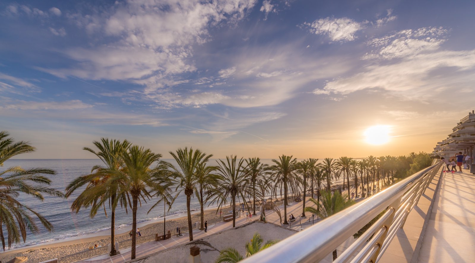 Sunset over Marbella's seafront promenade