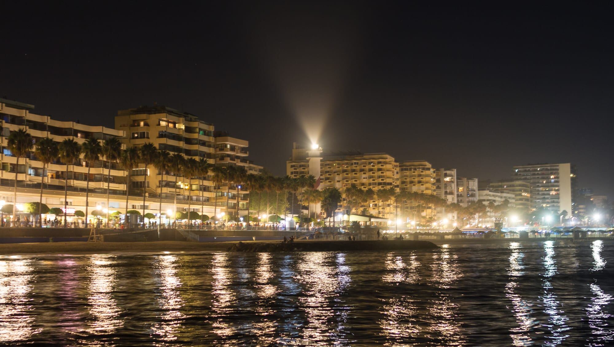 The Paseo Marítimo in Marbella lit at night