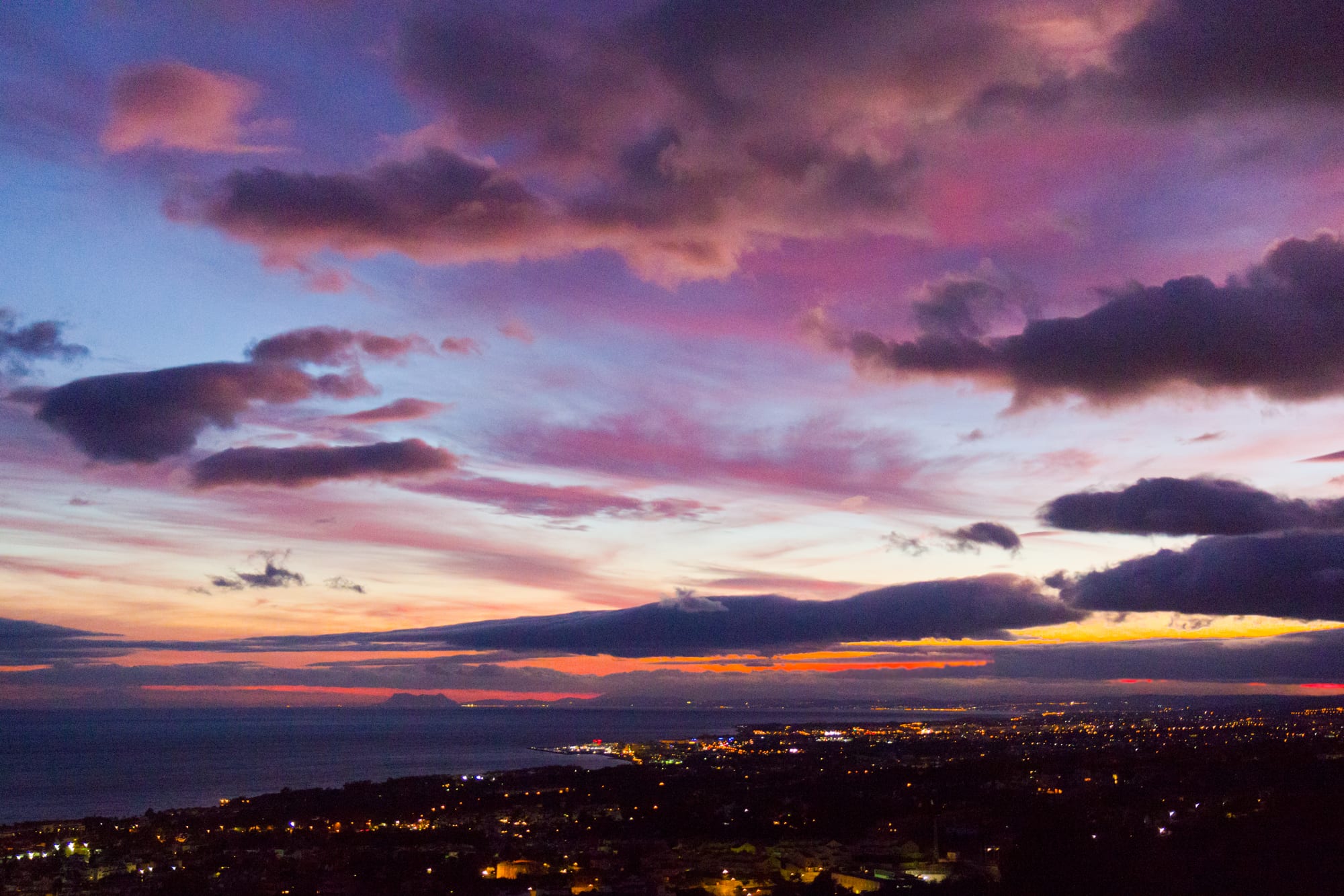 Overcast winter sunset over the Marbella seafront