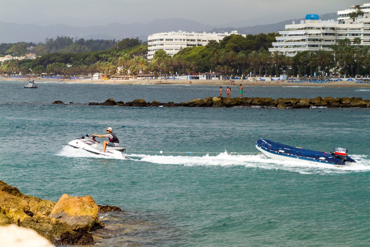 A water scooter on the sea off a Marbella beach in midsummer