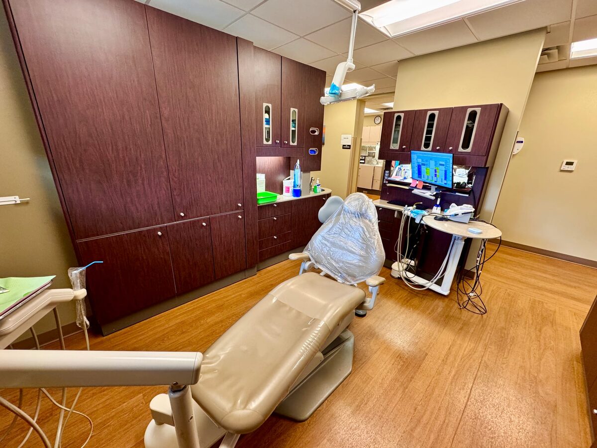A dental treatment chair and equipment in a dentist’s clinic