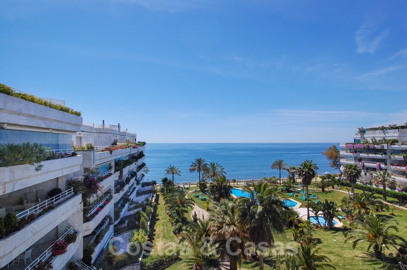 Terraced apartment blocks, gardens and pool at Playa Esmeralda on the Golden Mile beachfront in Marbella